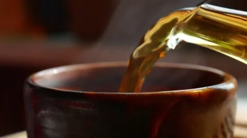 Tea is poured into a bowl, close-up Video stock 156759629