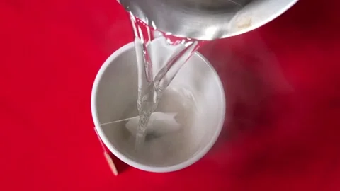 Tea is poured into the cup Stock Footage 220925585