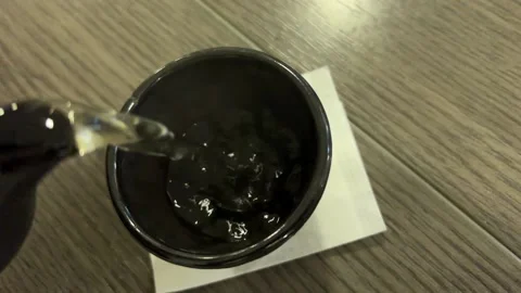 Tea is poured into the cup Video stock 230082983