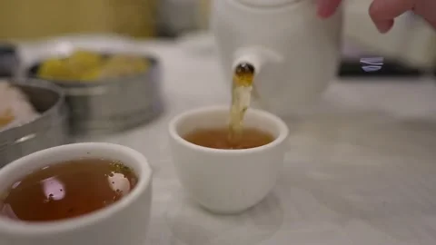 Tea poured at dim sum restaurant Stock Footage 156822010