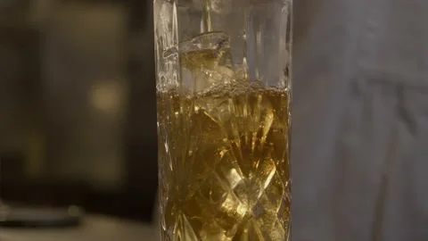Tea poured in a glass with ice Stock-Footage 220850140