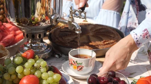 Tea is poured from the samovar Stock Footage 127790448