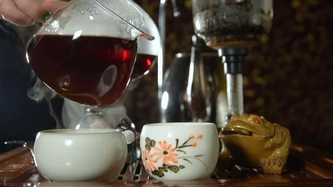 Tea is poured in a special container for tea ceremony Stock Footage 74451054