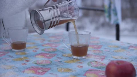 Tea is Poured from a Teapot in Winter Stock Footage 144637488