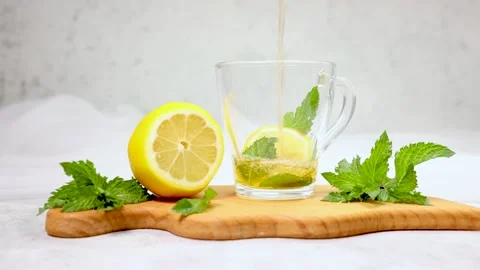  tea is poured into a transparent cup of 4 K Video stock 162323174