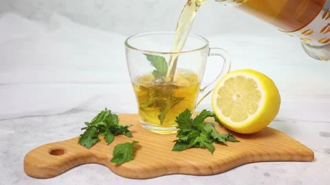 Tea is poured into a transparent cup of 4 K Stock Footage 162323193