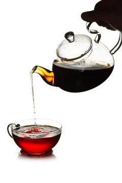 Tea pouring concept Stock Photos