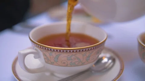 TEA POURING INTO CUP Stock Footage