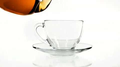 Tea pouring in the cup isolated on white Stock Footage 88417157
