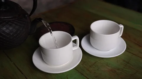 Tea pouring into cups close up Stock Footage 331200779