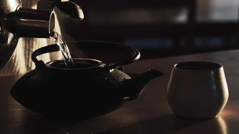 Tea - Pouring Hot Water Into Kettle - Slow Motion - Evening Relaxation Stock Footage 130742512
