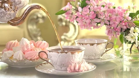 Tea Pouring. Porcelain cup of Healthy Tea closeup. Stock Footage