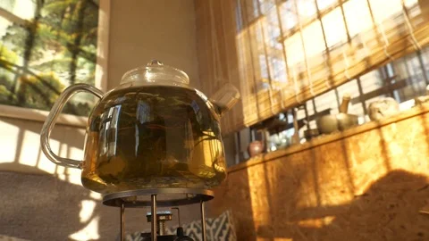 Tea pouring. Tea bubbles. Tea being poured into glass transparent tea cup Video stock 107168160