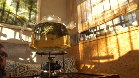 Tea pouring. Tea bubbles. Tea being poured into glass transparent tea cup Video stock 107168163