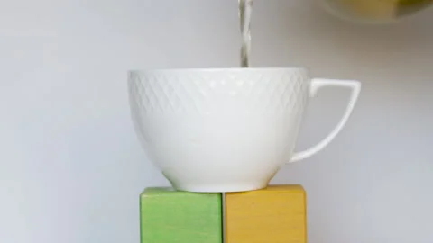 Tea pouring in white ceramic cup. Stock Footage 180065529