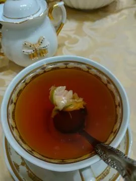 Tea rose in a cup of tea Stock Photos