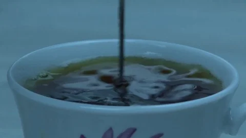 Tea rotations in white cup 스톡 동영상 80634288