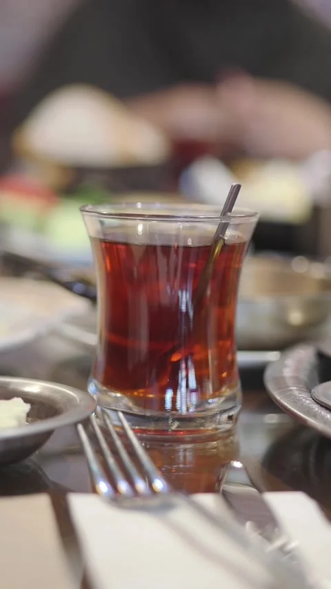 Tea served in a glass at a table setting Stock Footage 340244087
