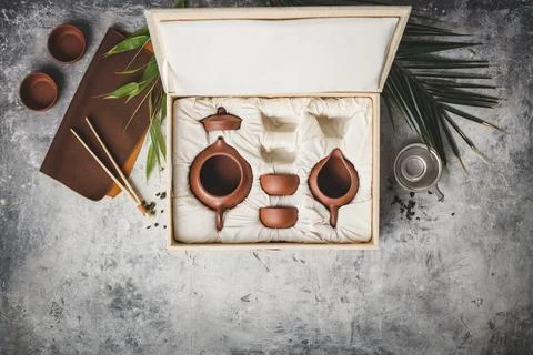 Tea set in the box on concrete background Stock Photos