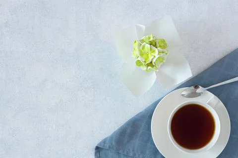Tea set in a composition with marshmallow flowers. top view, copy of space. C Stock Photos