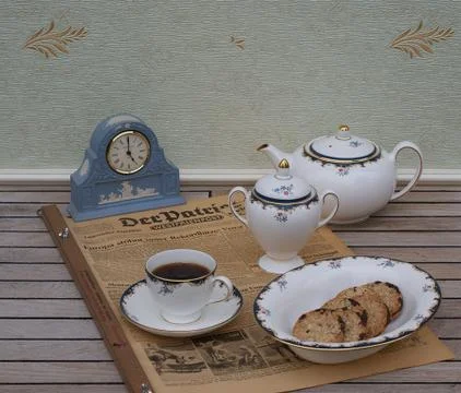 Tea set in front of a pale blue Wedgwood watch, Jasperware Stock Photos