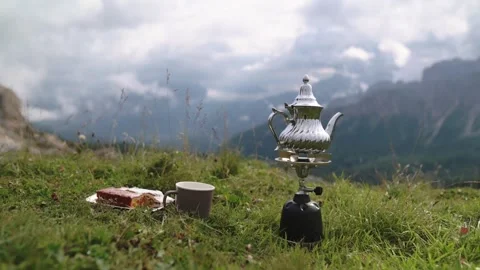 Tea set with mountain background in green valley of Dolomitines Alpes 스톡 동영상 318823965