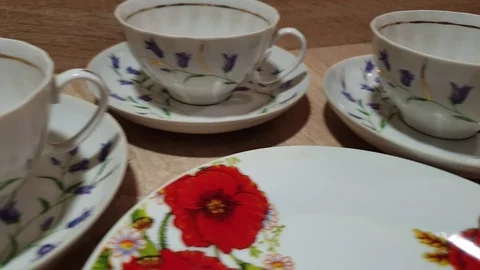 Tea-set. Porcelain tableware set. Plates and cups. Stock Footage 119533881