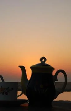 Tea set at sunset Stock Photos