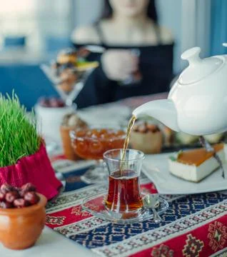 Tea setup with black tea in armudu glass, jams and samani Stock Photos