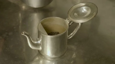 Tea in a silver teapot 動画素材 220846363