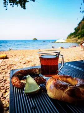 Tea, simit, cheese, pastry on the beach Stock Photos