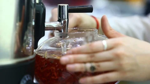 Tea sommelier pours boiling water into the kettle Stock Footage 129273773