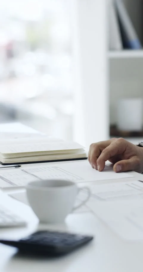 Tea, spill and hand with computer, office and accountant with paperwork for tax Stock Footage 329755228