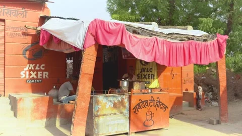 Tea Stall with Orange Facade and Red Canopy Stock Footage 325091959