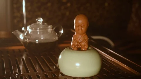 Tea statuette made of clay - boy who's peeing Stock-Footage 74450211