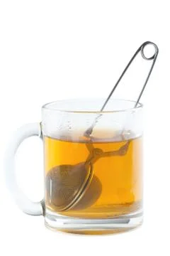 Tea strainer in cup Stock Photos