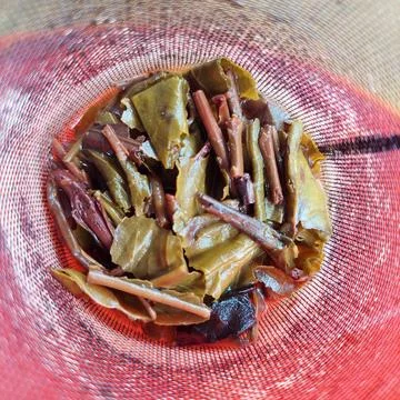 A tea strainer in the form of a wire mesh inside the teapot Stock Photos