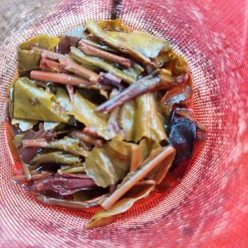 A tea strainer in the form of a wire mesh inside the teapot Stock Photos