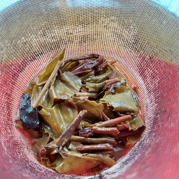 A tea strainer in the form of a wire mesh inside the teapot Stock Photos