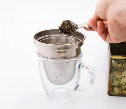 Tea in strainer 스톡 사진