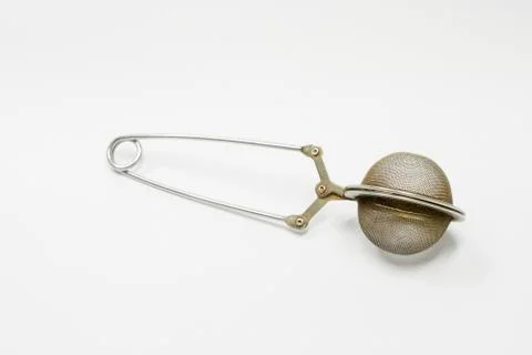 Tea strainer spring mesh ball enclosure of old Stock Photos