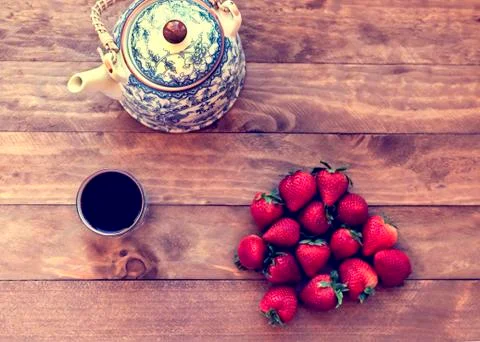 Tea with strawberries Stock Photos