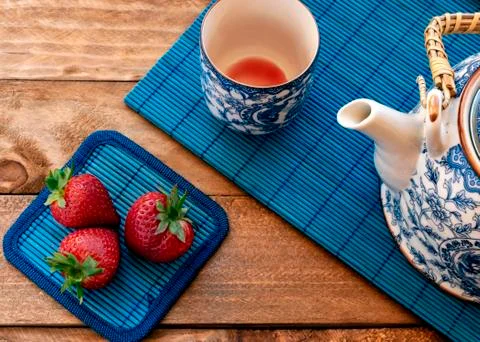 Tea with strawberries Stock Photos
