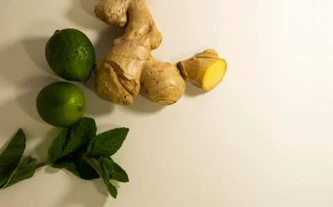 Tea supplement ginger root, peppermint leaves and lime fruit. Copy space Stock Photos