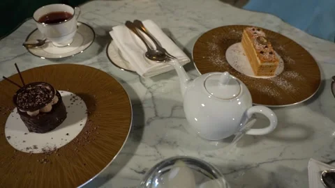 Tea table, a cake, a cup of tea and a teapot 6 Stock Footage 295223200