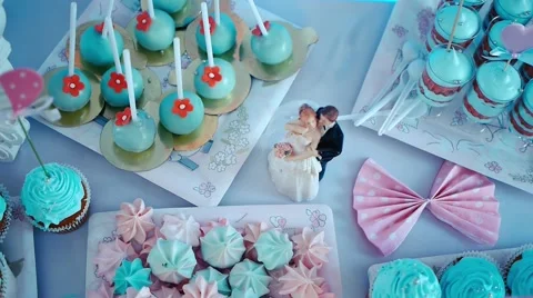 Tea table figurine on cake candy chocolate decor wedding cake bride and groom Stock Footage 61390874
