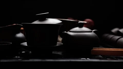 Tea table with utensils on black background Video stock 113113605