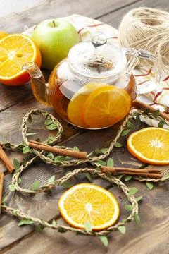 Tea with thyme and orange tea in a transparent teapot Stock Photos