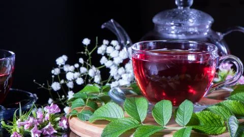Tea time: cup of tea, carcade, karkade, rooibos.  Red hot hibiscus tea in gla Photos