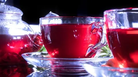 Tea time: cup of tea, carcade, karkade, rooibos. Red hot hibiscus tea in glas 스톡 사진